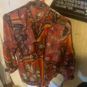 Blouse lace up half way.  Colors are blk brns purple red ohm. elastic waist